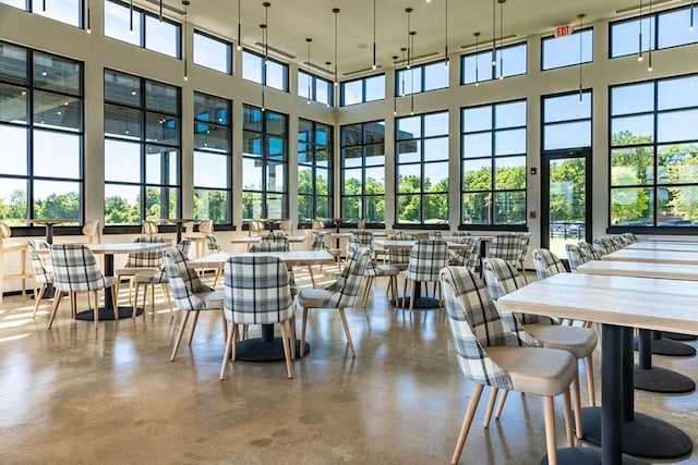 129 Southwind Run, Spring Hill, TN 37174 - dining area featuring a high ceiling, plenty of natural light, and concrete flooring