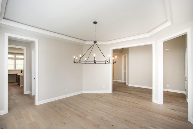 5956 Hunt Valley Dr, Spring Hill, TN 37174 - unfurnished dining area featuring a chandelier, a raised ceiling, light wood-type flooring, and baseboards