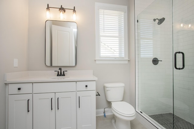 5956 Hunt Valley Dr, Spring Hill, TN 37174 - bathroom featuring toilet, a stall shower, vanity, baseboards, and tile patterned flooring