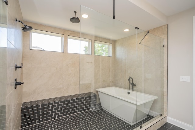 5956 Hunt Valley Dr, Spring Hill, TN 37174 - bathroom with tiled shower, a freestanding tub, recessed lighting, and tile patterned floors