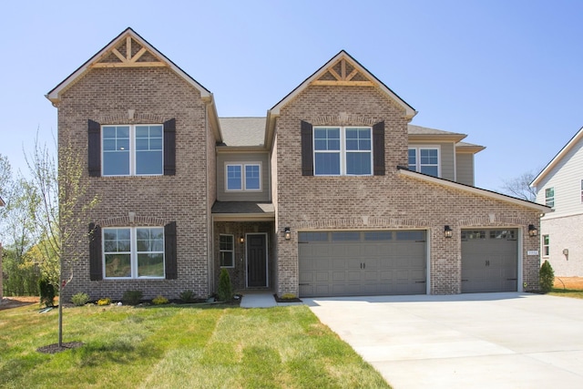 5956 Hunt Valley Dr, Spring Hill, TN 37174 - view of front facade featuring concrete driveway, brick siding, and a front lawn