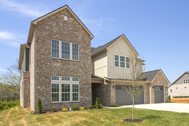 5952 Hunt Valley Dr, Spring Hill, TN 37174 - traditional home with brick siding, driveway, a front yard, board and batten siding, and a garage