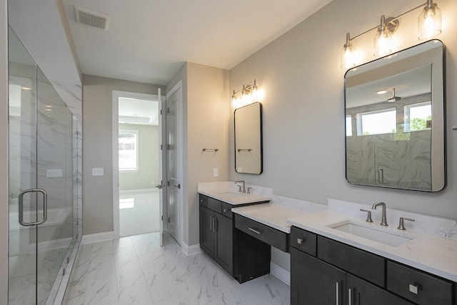 5952 Hunt Valley Dr, Spring Hill, TN 37174 - bathroom with a marble finish shower, vanity, and plenty of natural light