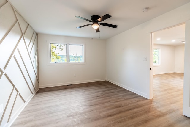 1320 Napier Lake Rd, Hohenwald, TN 38462 - unfurnished bedroom with light wood-style floors, baseboards, and a ceiling fan