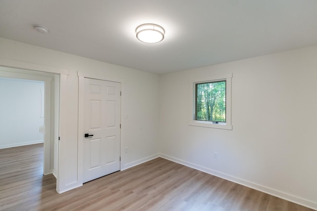 1320 Napier Lake Rd, Hohenwald, TN 38462 - spare room featuring light wood-style floors, baseboards, and a smoke detector