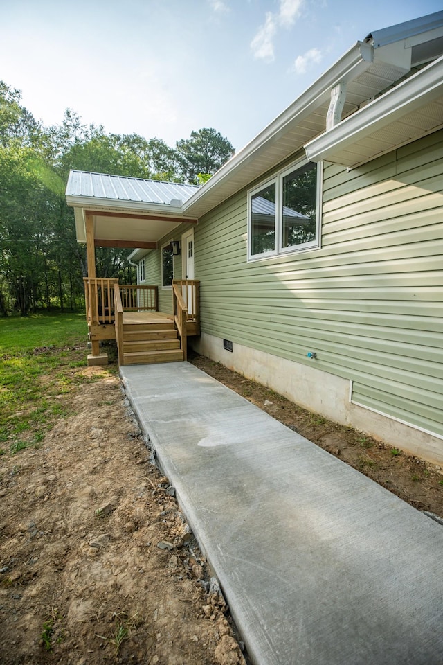 1320 Napier Lake Rd, Hohenwald, TN 38462 - view of property exterior with crawl space and metal roof