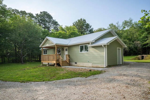 1320 Napier Lake Rd, Hohenwald, TN 38462 - view of front of home featuring metal roof, a front yard, a porch, crawl space, and driveway