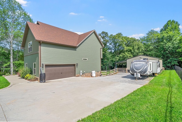 1415 Southside Rd, Southside, TN 37171 - view of side of property featuring a garage, roof with shingles, and driveway
