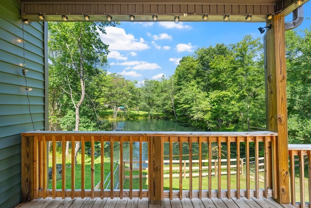 1415 Southside Rd, Southside, TN 37171 - deck with a water view, a lawn, and view of wooded area