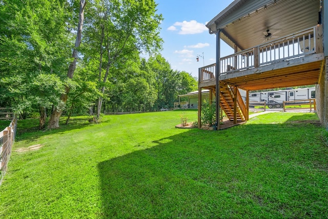 1415 Southside Rd, Southside, TN 37171 - view of grassy yard with stairway and a wooden deck
