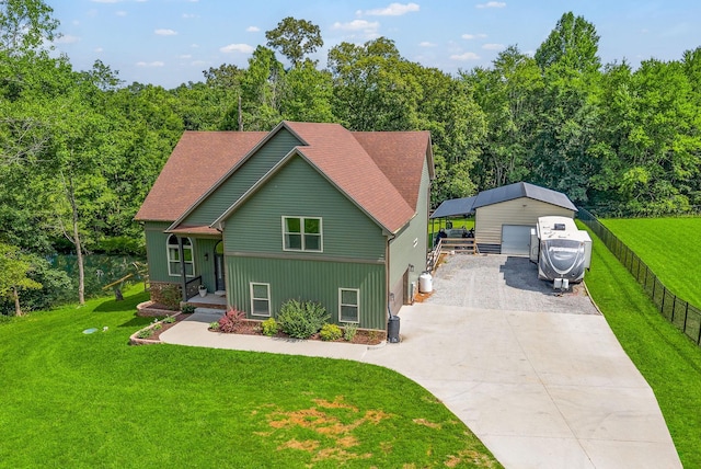 1415 Southside Rd, Southside, TN 37171 - chalet / cabin with an outbuilding, a detached garage, and driveway