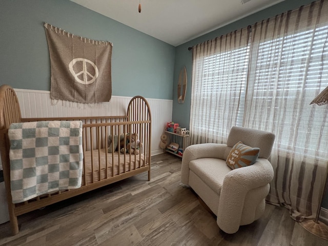 219 Dugger Dr, Clarksville, TN 37042 - bedroom featuring wainscoting, lofted ceiling, and wood finished floors
