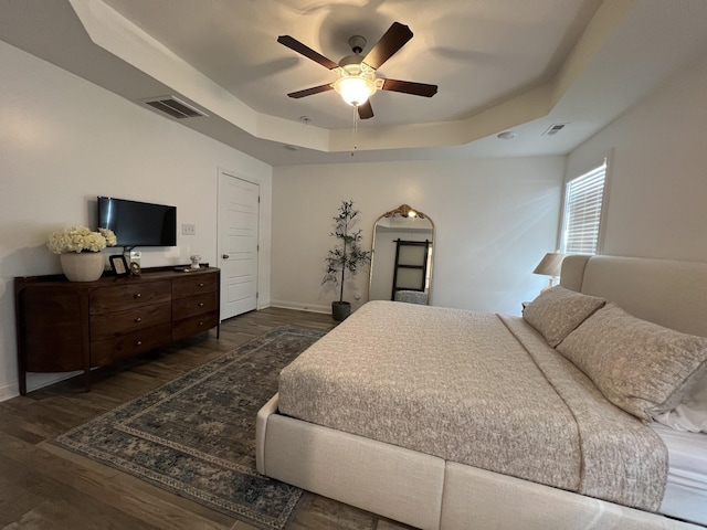 219 Dugger Dr, Clarksville, TN 37042 - bedroom featuring a tray ceiling, baseboards, wood finished floors, and ceiling fan