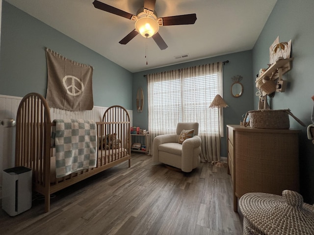 219 Dugger Dr, Clarksville, TN 37042 - bedroom with wood finished floors, lofted ceiling, a crib, and ceiling fan