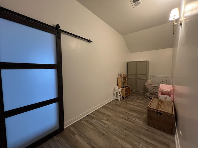 219 Dugger Dr, Clarksville, TN 37042 - walk in closet with wood finished floors, a barn door, and lofted ceiling