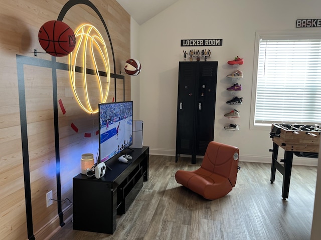 219 Dugger Dr, Clarksville, TN 37042 - living area with wood finished floors, vaulted ceiling, and baseboards
