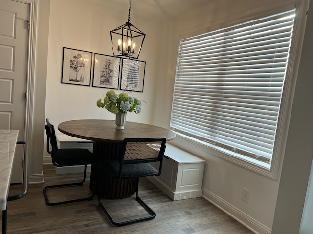 219 Dugger Dr, Clarksville, TN 37042 - dining room with light wood-type flooring, baseboards, and a chandelier