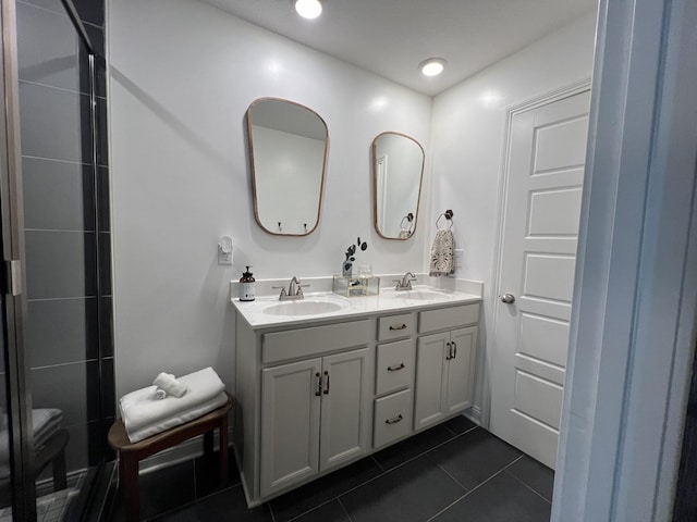 219 Dugger Dr, Clarksville, TN 37042 - full bath featuring double vanity, tile patterned flooring, toilet, recessed lighting, and a tile shower