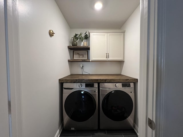 219 Dugger Dr, Clarksville, TN 37042 - washroom with washer and clothes dryer, cabinet space, tile patterned flooring, and baseboards