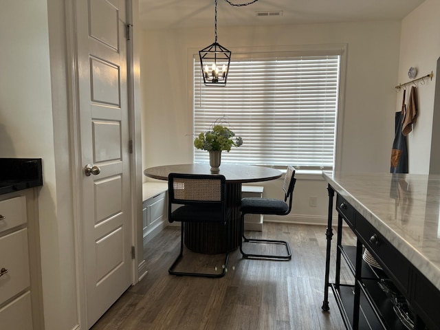 219 Dugger Dr, Clarksville, TN 37042 - dining space with dark wood-style floors and a chandelier