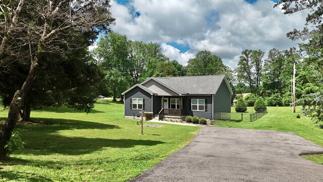 110 Saw Mill Rd, Dickson, TN 37055 - view of front facade featuring a porch, a front lawn, and a shingled roof