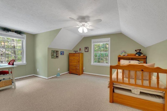 891 Deepwoods Rd, Sewanee, TN 37375 - bedroom with a textured ceiling, lofted ceiling, baseboards, carpet flooring, and ceiling fan