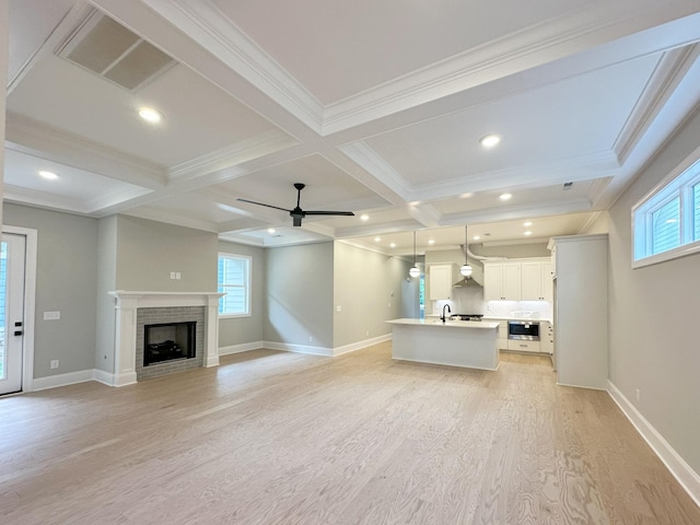 7131 Frances St, Fairview, TN 37062 - unfurnished living room featuring light wood-style floors, plenty of natural light, coffered ceiling, beamed ceiling, and ceiling fan
