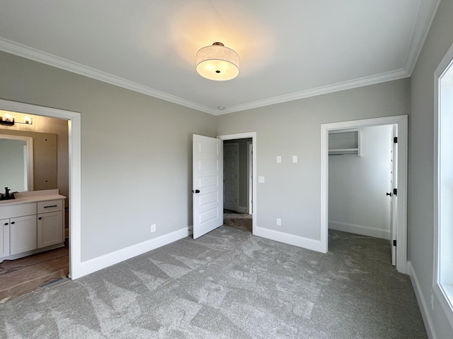 7131 Frances St, Fairview, TN 37062 - unfurnished bedroom featuring ornamental molding, carpet floors, a spacious closet, ensuite bath, and a closet