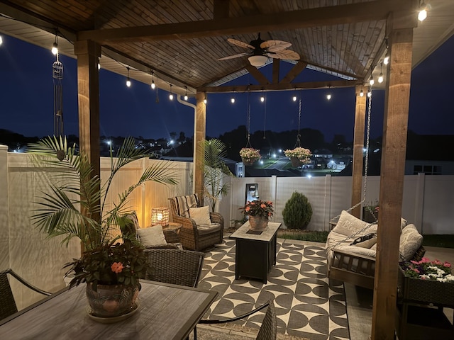 2932 Hen Brook Dr, Columbia, TN 38401 - patio at twilight with outdoor lounge area, ceiling fan, a fenced backyard, and a patio