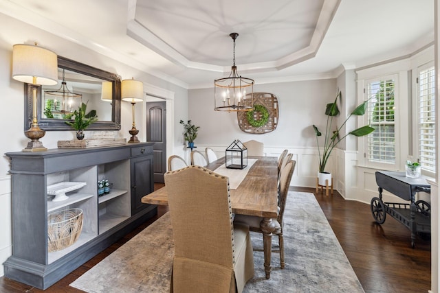 9201 Dutch Belted Ct, Nolensville, TN 37135 - dining area with a chandelier, wainscoting, dark wood finished floors, ornamental molding, and a raised ceiling