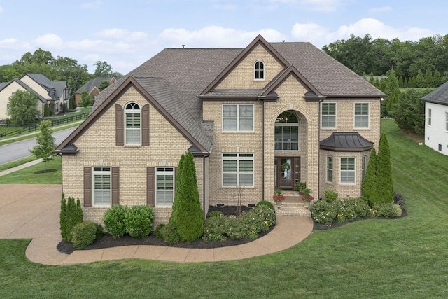 9201 Dutch Belted Ct, Nolensville, TN 37135 - view of front of home with brick siding, a front lawn, and a shingled roof