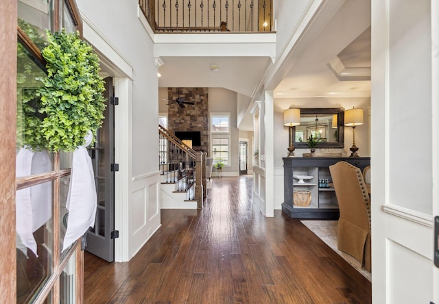 9201 Dutch Belted Ct, Nolensville, TN 37135 - entrance foyer featuring dark wood finished floors, stairway, a decorative wall, a wainscoted wall, and a high ceiling