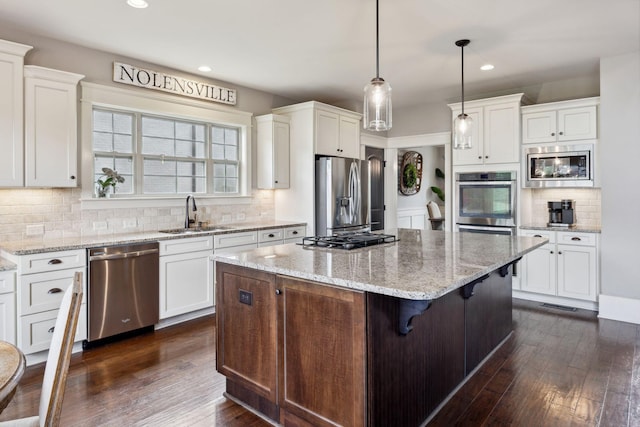 9201 Dutch Belted Ct, Nolensville, TN 37135 - kitchen with stainless steel appliances, a sink, white cabinetry, recessed lighting, and backsplash