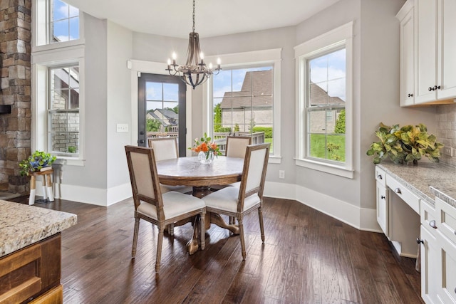 9201 Dutch Belted Ct, Nolensville, TN 37135 - dining area with a chandelier, dark wood finished floors, and baseboards