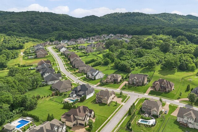 9201 Dutch Belted Ct, Nolensville, TN 37135 - aerial view of property and surrounding area with nearby suburban area and a heavily wooded area
