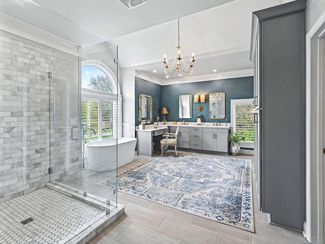 1004 Jones Pkwy, Brentwood, TN 37027 - full bath featuring vanity, a freestanding bath, a stall shower, a chandelier, and ornamental molding