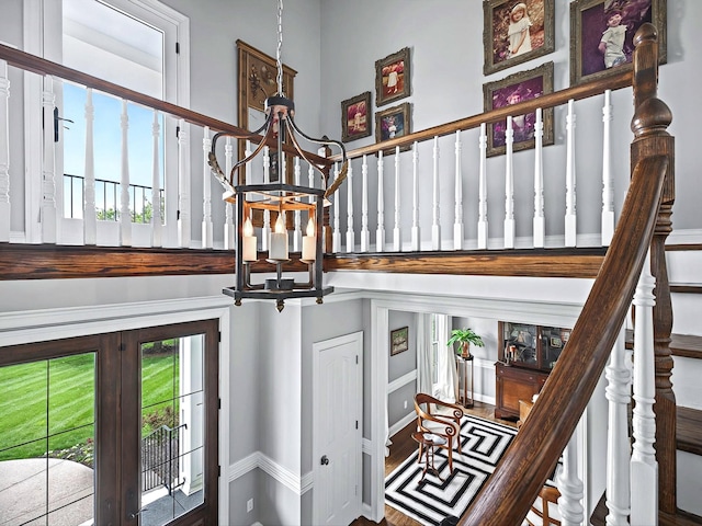1004 Jones Pkwy, Brentwood, TN 37027 - stairway with a chandelier and french doors