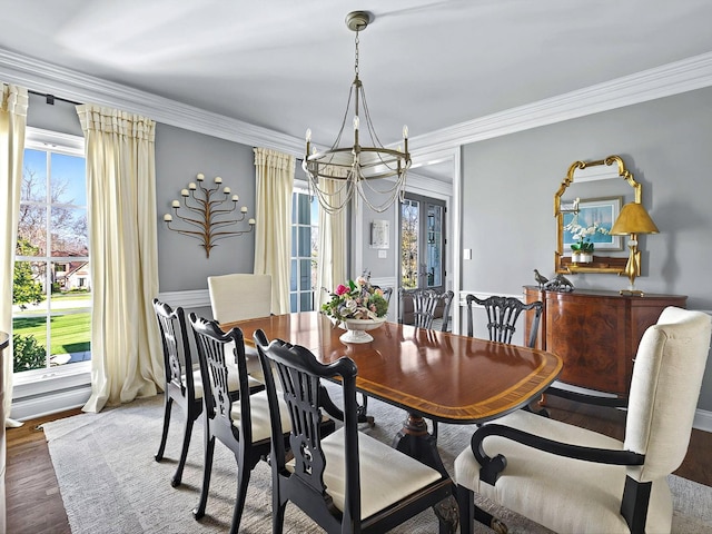 1004 Jones Pkwy, Brentwood, TN 37027 - dining space with a chandelier, healthy amount of natural light, wood finished floors, and ornamental molding