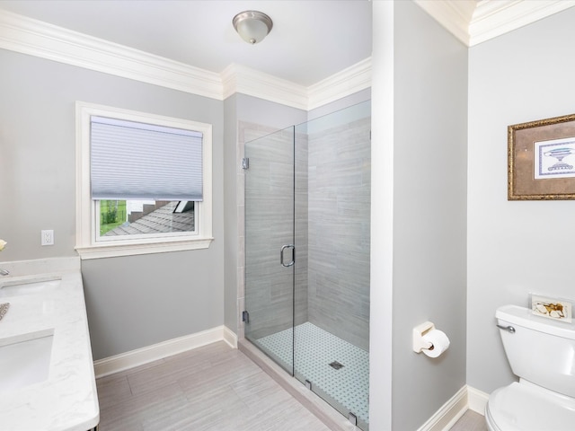 1004 Jones Pkwy, Brentwood, TN 37027 - bathroom featuring toilet, a shower stall, ornamental molding, baseboards, and double vanity