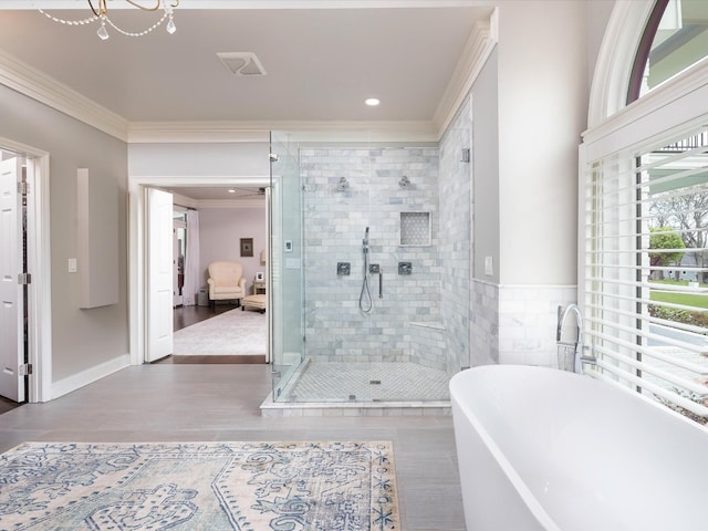 1004 Jones Pkwy, Brentwood, TN 37027 - full bath with a freestanding tub, a stall shower, ornamental molding, wood finished floors, and recessed lighting