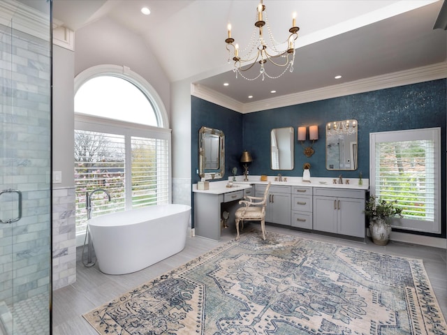 1004 Jones Pkwy, Brentwood, TN 37027 - bathroom with a chandelier, double vanity, a freestanding bath, a shower stall, and high vaulted ceiling