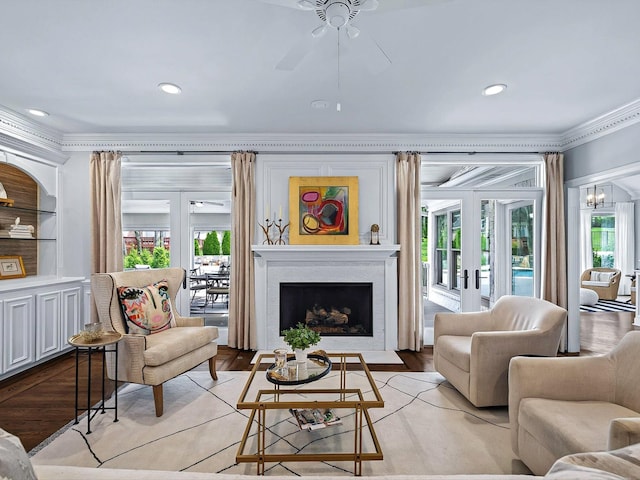 1004 Jones Pkwy, Brentwood, TN 37027 - living room with ornamental molding, french doors, a fireplace with flush hearth, ceiling fan, and recessed lighting