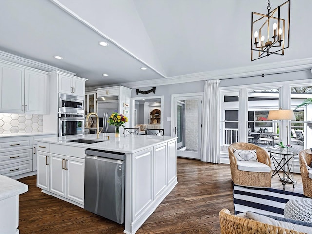 1004 Jones Pkwy, Brentwood, TN 37027 - kitchen with built in appliances, a sink, white cabinets, light countertops, and crown molding
