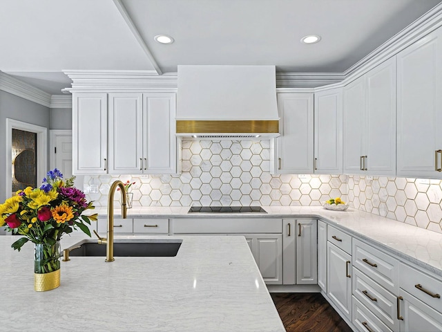 1004 Jones Pkwy, Brentwood, TN 37027 - kitchen featuring custom exhaust hood, a sink, black electric stovetop, white cabinets, and recessed lighting