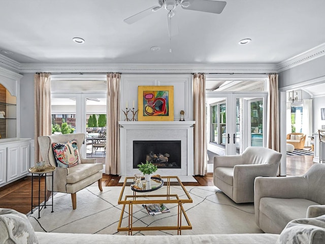 1004 Jones Pkwy, Brentwood, TN 37027 - living room featuring ornamental molding, french doors, healthy amount of natural light, a ceiling fan, and a fireplace with flush hearth