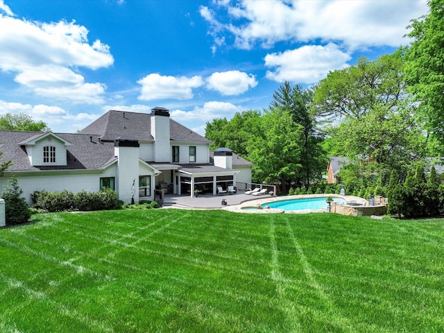 1004 Jones Pkwy, Brentwood, TN 37027 - back of house with a patio area, a lawn, roof with shingles, a chimney, and a pool with connected hot tub