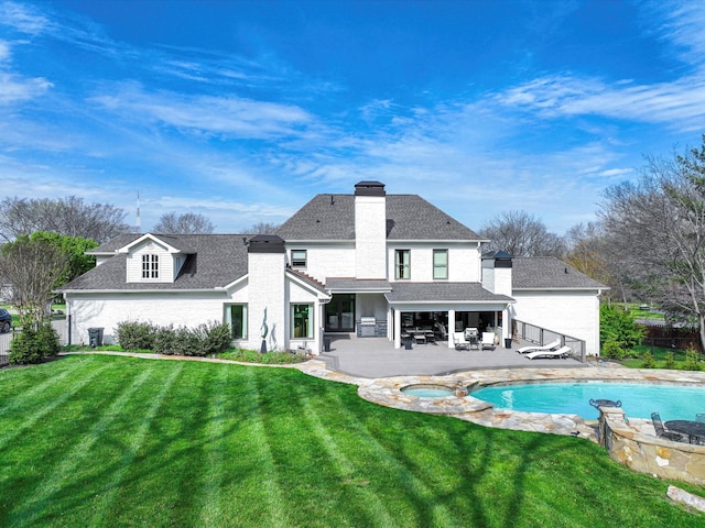 1004 Jones Pkwy, Brentwood, TN 37027 - rear view of property with a chimney, an outdoor fire pit, a patio, roof with shingles, and a pool with connected hot tub