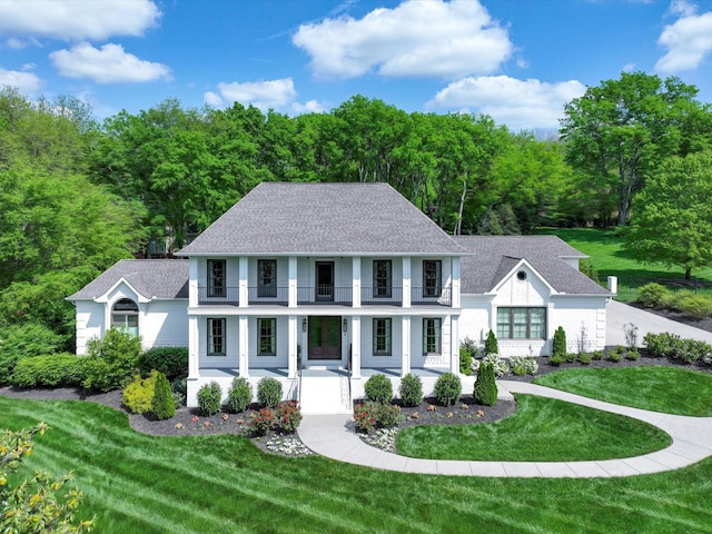 1004 Jones Pkwy, Brentwood, TN 37027 - view of front of house with a balcony, a porch, a shingled roof, and a front yard