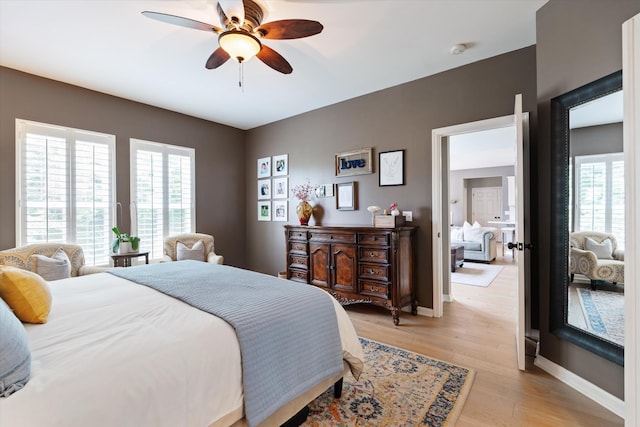 736 Arbor Springs Dr, Mount Juliet, TN 37122 - bedroom with multiple windows, light wood-type flooring, baseboards, and a ceiling fan