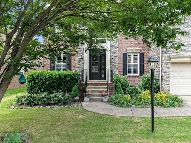 736 Arbor Springs Dr, Mount Juliet, TN 37122 - view of front of home with a front lawn, brick siding, and an attached garage